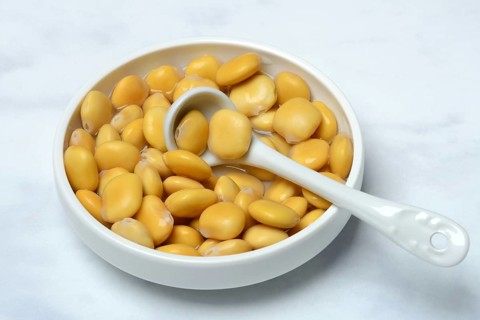 Lupine (Lupinus), pickled lupine seed in small bowls
