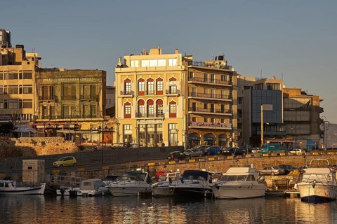 Morning light, boats, houses, harbour, blue sky, Heraklion, capital, island of Crete, Greece,