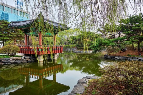 SEOUL, SOUTH KOREA, APRIL 8, 2017: Yeouido Park public park pond with pavilion summerhouse in