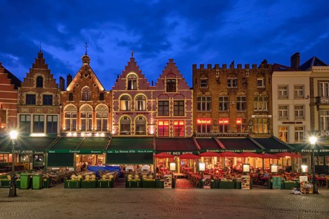 Bruges, Belgium, May 29, 2018: Bruges Grote markt square famous tourist place with many cafe and