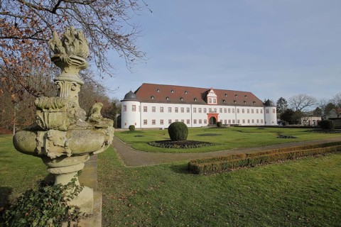 Schönborn Castle with stone sculpture Heusenstammer Schloss, Heusenstamm, Hesse, Germany, Europe