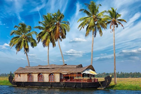 Kerala travel tourism background, houseboat on Kerala backwaters. Kerala, India, Asia