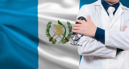 Doctor with stethoscope on guatemalan flag. Doctor arms crossed with stethoscope on Guatemalan