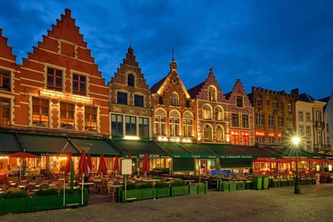 Bruges, Belgium, May 29, 2018: Bruges Grote markt square famous tourist place with many cafe and