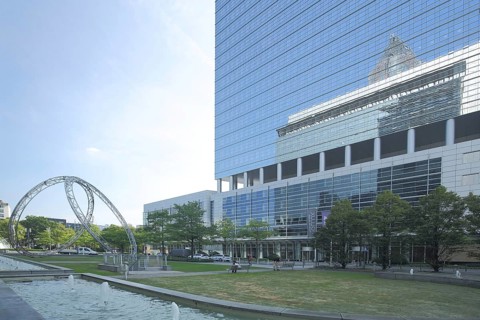 Sculpture Synergy by Christian Herdeg 1997 with reflection of Pollux and Kastor, glass building,