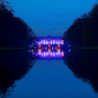 Illuminated Benrath Palace in the evening with the mirror pond at Christmas Wunderwelt, Düsseldorf,