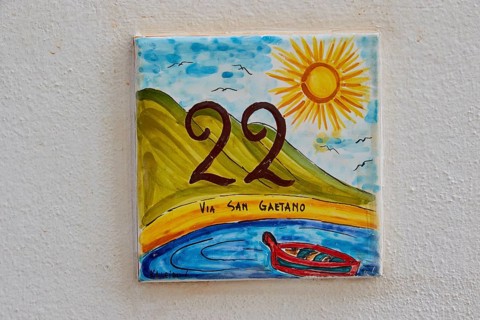 Colourful tile as street sign, Via San Gaetano, Rinella, town on the south coast, Salina, Aeolian
