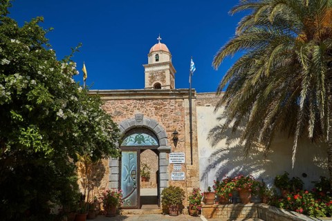 Entrance gate, blue door, bell tower, red dome, palm tree, blue cloudless sky, Toplou, Orthodox
