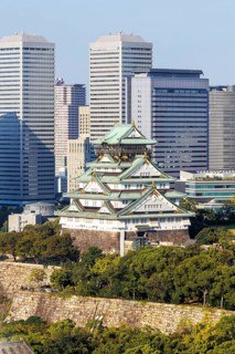 Osaka Castle from above with the skyline skyscrapers in Osaka, Japan, Asia
