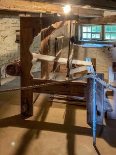 Historical loom in old rebuilt restored small farmhouse weaver's house half-timbered house in