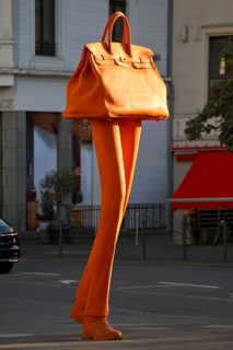 The bronze sculpture Walking Bag by Erwin Wurms at the entrance of the urban shopping zone, Bonn,