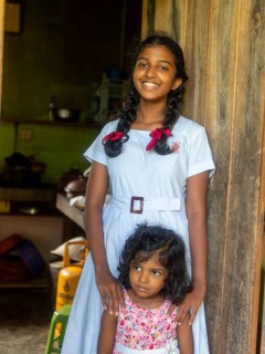 Sinhalese schoolgirl with white clothes, black braids and red ribbons, Sri Lanka, Asia