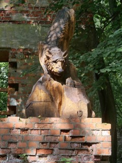 Wolf carved in wood in the ruins of the Wolf's Lair (also Wolfschanze), the military situation