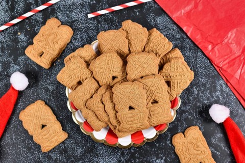 Speculaas or speculoos, a spiced thin, crunchy and caramelized and shortcrust biscuit with figure