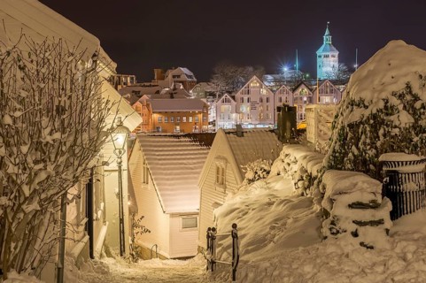 Snow-covered wooden buildings, night scene, historic town centre, Stavanger, Rogaland, Norway,