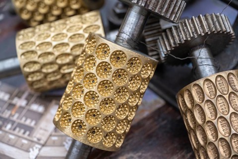 Profiled metal rollers, machine parts, embossing rollers, brass matrices for the production of