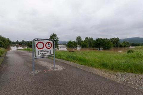 Symbolic image extreme weather, global warming, climate change, information board, flood retention