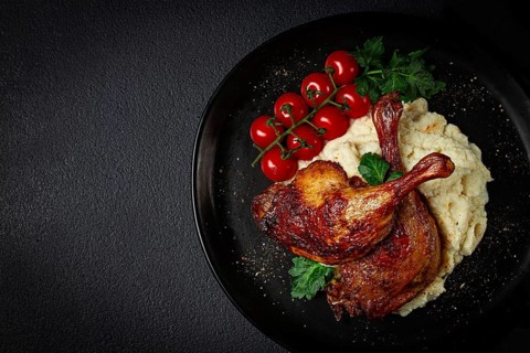 Fried duck shank, cauliflower puree, cherry tomatoes, homemade, no people