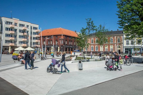 People on the square in the modern center of Swinoujscie, Western Pomerania, Poland, Eastern
