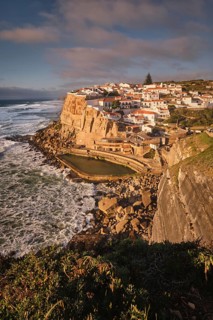 Scenic view of the seaside Azenhas do Mar fishing village on cliff on Atlantic ocean coast,