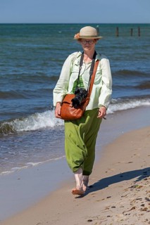 Elderly woman walking barefoot on the beach, Darßer Ort, Born a. Darß, Mecklenburg-Vorpommern,