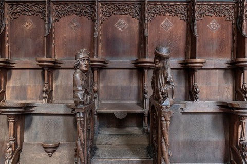 Figures on the late Gothic choir stalls from 1507, St Martin, Memmingen, Bavaria, Germany, Europe