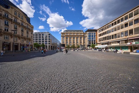 White and grey cumulus clouds with blue sky over Rathenauplatz in Frankfurt am Main, district-free