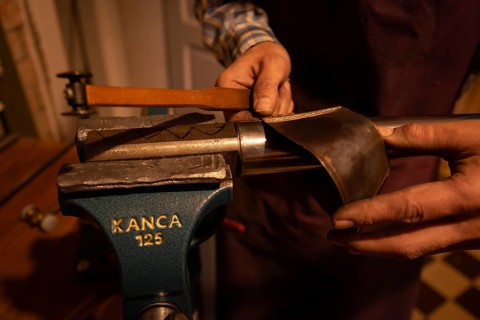 Metal instrument maker dovetails a rim blank for a trombone, Magdeburg, Saxony-Anhalt, Germany,