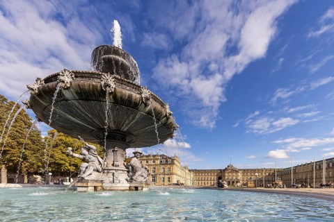 Palace square with New Palace. Fountain with fountain bowl. Place of interest in Stuttgart,