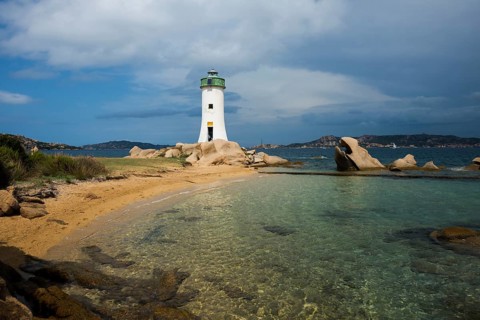 Lighthouse with beach and bizarre granite rocks, Spiaggia Porto Faro, Faro di Punta Palau, Palau,