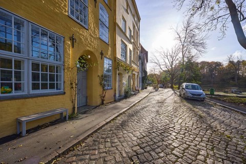 Street An der Obertrave, cobblestone pavement, historic buildings, backlight and sidelight of the