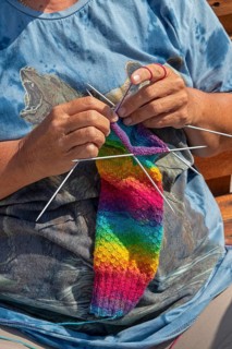 Woman knitting, colourful jumper, detail, Wustrow, Darß, Mecklenburg-Vorpommern, Germany, Europe