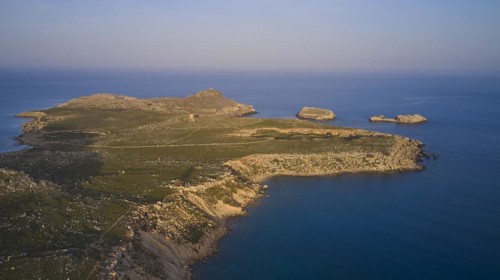 Drone shot, near Acropolis of Lindos, late afternoon light, drone shot of a remote island with