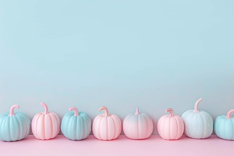 Small pastel pink and blue pumpkins in a row on pastel background with copy space. Generative AI,