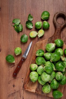 Fresh Brussels sprouts, raw, top view, on a wooden table, no people