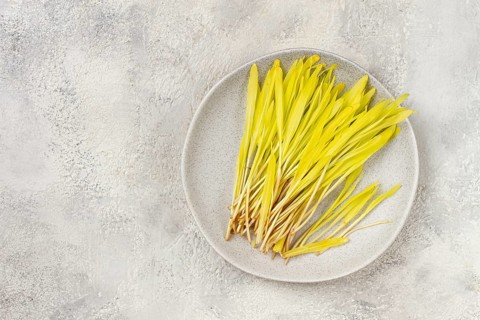 Microgrown corn, a bouquet of microgrown, on a light plate, there are no people.