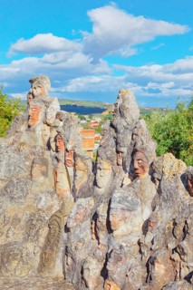 Heads carved into rocks at Enchanted Castle, Sciacca, Agrigento district, Sicily, Italy, Europe