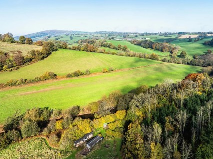 Fields and Farms over Skenfrith Castle from a drone, Monmouthshire, Wales, England, United Kingdom,