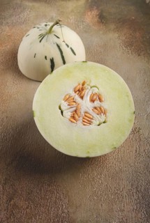 Dino melon, cut, on the table, top view, no people, Dino melon, cut, on the table, top view, no