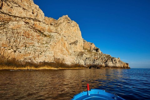 Evening light, boat tour, boat bow, view from the sea, bizarre rock formations, rugged mountains,