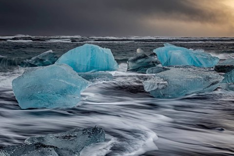 Ice floes in the sea during a storm and heavy spray, Breidamerkursandur, Jökulsarlon, south-east