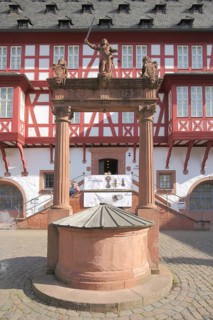 Ornamental fountain with Justitia at the Altstädter Markt in front of the Deutsches