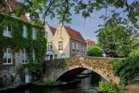 Bruges typical Belgian cityscape Europe tourism concept, canal and old houses and bridge. Brugge,
