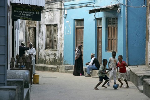 Black children playing in alley of the old medina of Stone Town, Stonetown, Mji Mkongwe, Zanzibar,