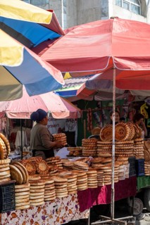 Woman selling bread, stall, Osh bazaar, Bishkek, Kyrgyzstan, Asia