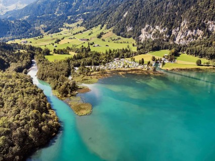 The Vorauen campsite on Lake Klöntal with the Chlü tributary, Klöntal, Canton Glarus, Switzerland,