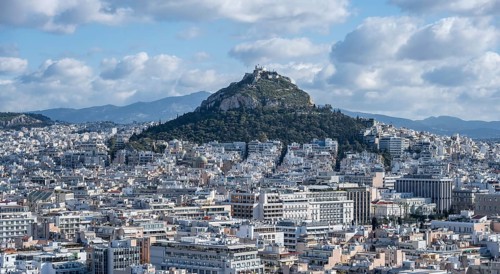 View over houses of Athens with Mount Lycabettus, Athens, Attica, Greece, Europe