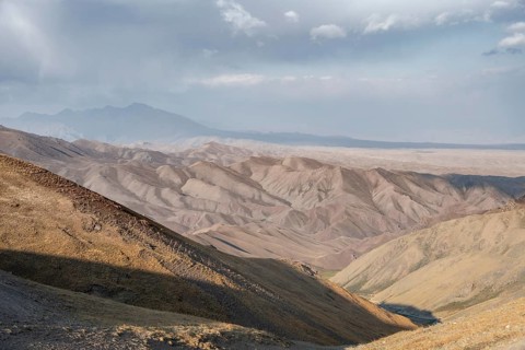 View of mountain landscape at Tyibel Pass, Song Kul Too mountain range, Naryn region, Kyrgyzstan,