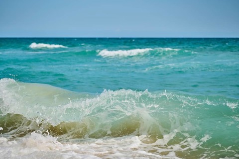 Breaking waves on a sandy beach, sunny, near Tarragona, Catalonia, Spain, Europe