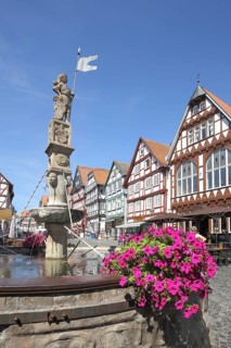 Half-timbered houses with market fountain, Rolandsbrunnen, market square, Fritzlar, Hesse, Germany,